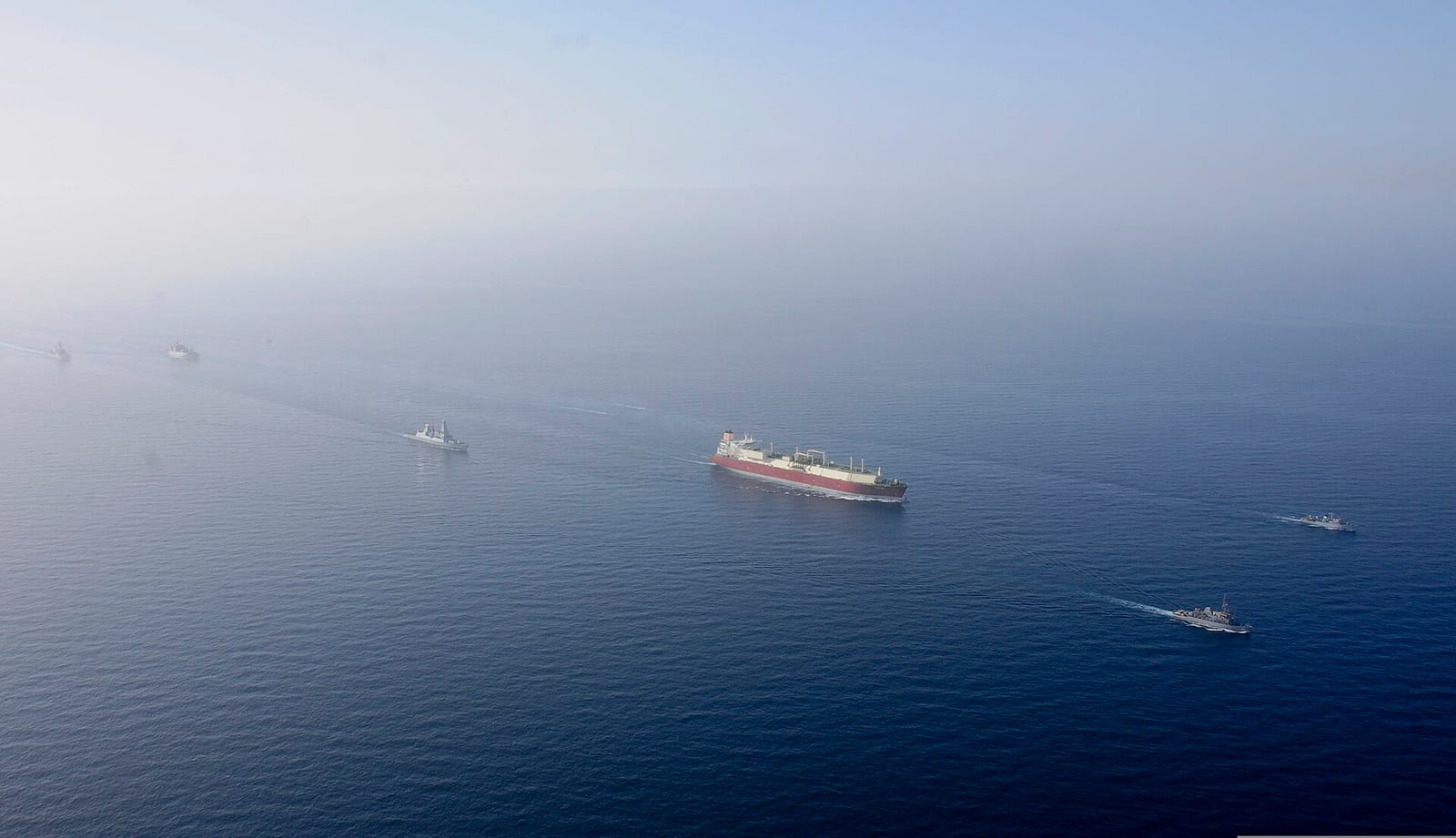 File photo: naval ships escort gas tanker in Persian Gulf, 2013
