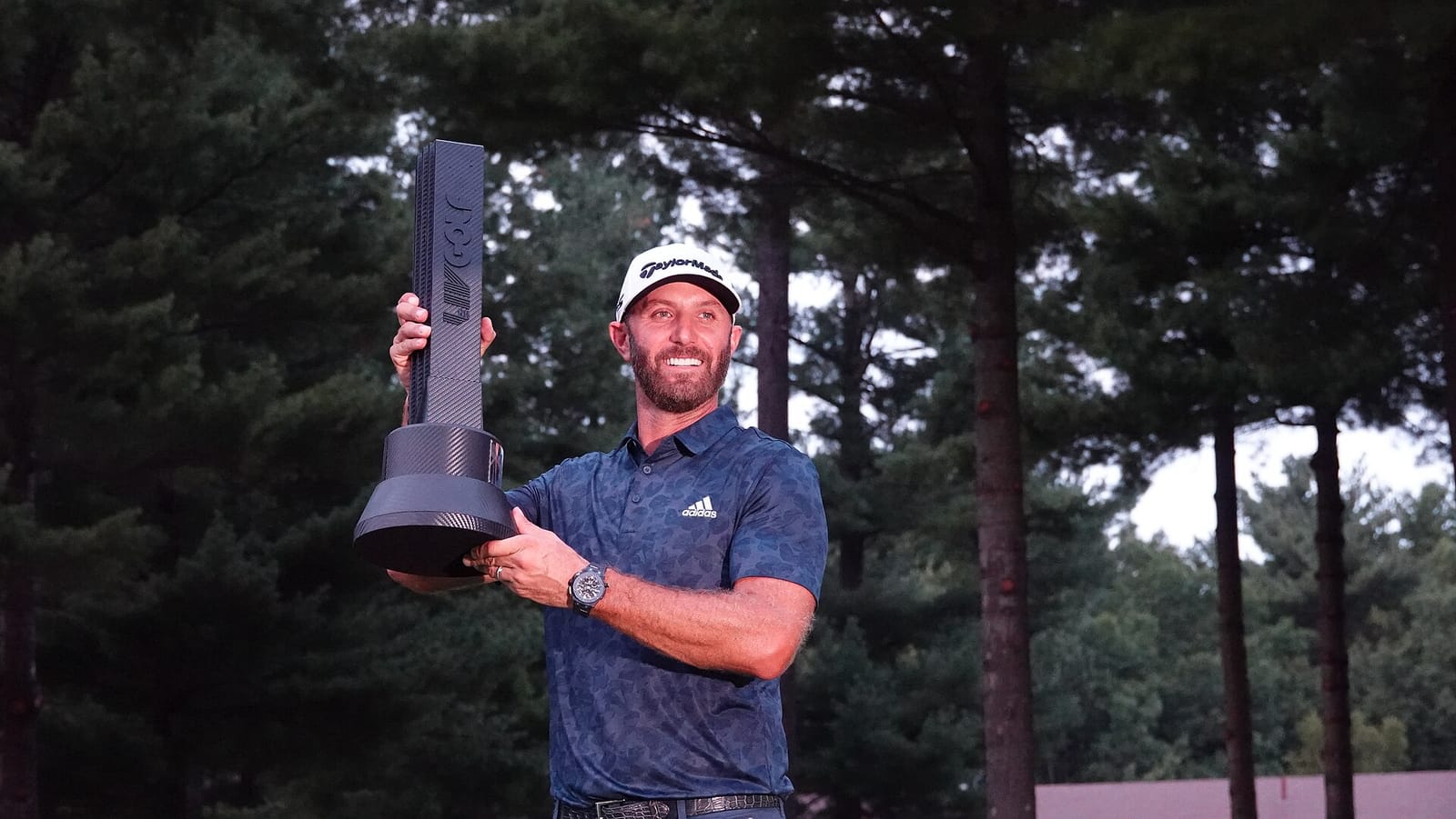 File photo: Dustin Johnson lifts trophy after winning LIV Golf Boston event