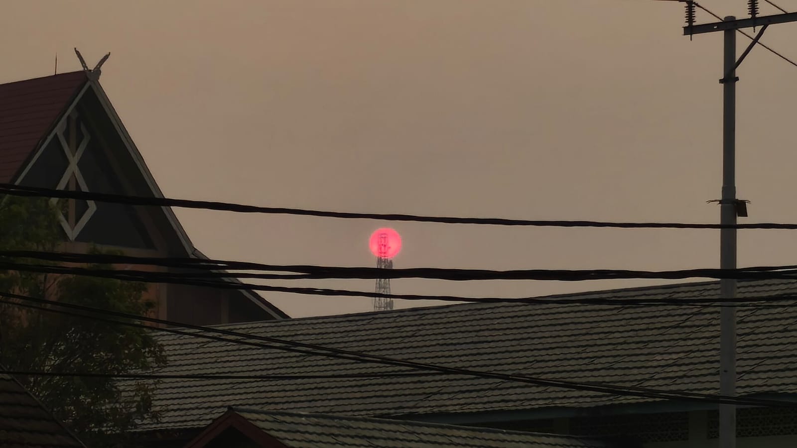 Thick smoke haze over a residential area in Kalimantan, August 2026