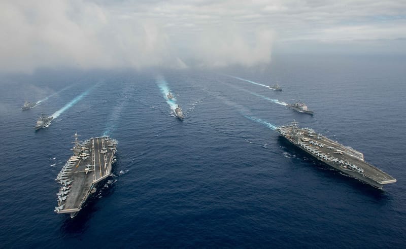 US official says three carriers deploying around Iran; tanker reportedly hit in Hormuz