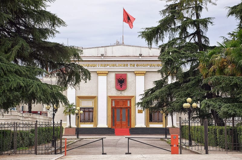 Albanian opposition lawmakers set off flares in parliament during central bank vote